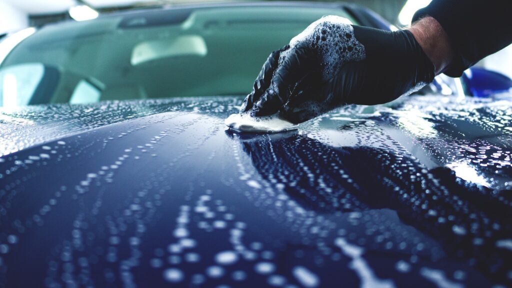 Professional clay bar treatment on a car in Swindon, removing contaminants for a smooth and shiny finish